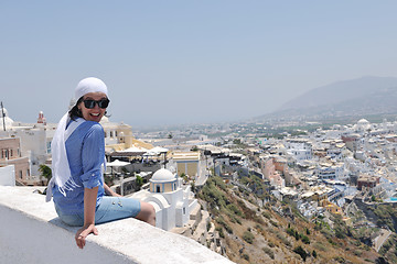 Image showing Greek woman on the streets of Oia, Santorini, Greece