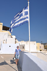 Image showing Greek woman on the streets of Oia, Santorini, Greece