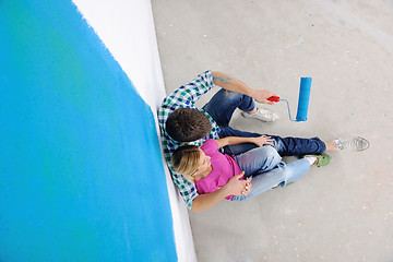 Image showing happy young cople relaxing after painting in new home