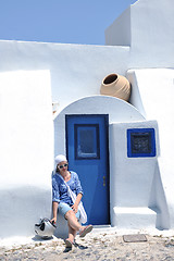 Image showing Greek woman on the streets of Oia, Santorini, Greece