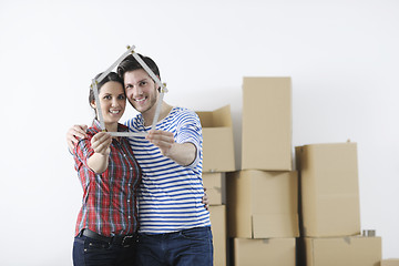 Image showing Young couple moving in new home