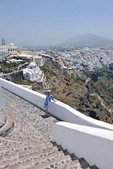 Image showing Greek woman on the streets of Oia, Santorini, Greece