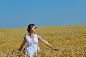 Image showing young woman in wheat field at summer