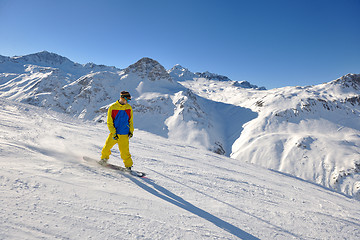 Image showing skiing on fresh snow at winter season at beautiful sunny day