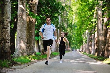 Image showing Young couple jogging