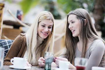 Image showing cute smiling women drinking a coffee