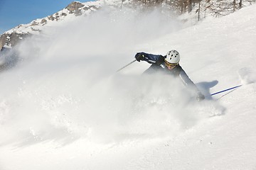 Image showing skiing on fresh snow at winter season at beautiful sunny day