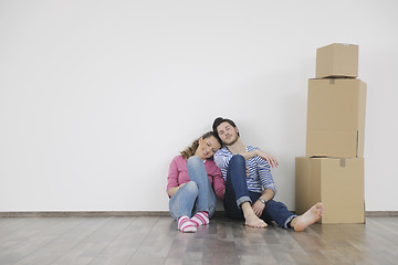 Image showing Young couple moving in new home