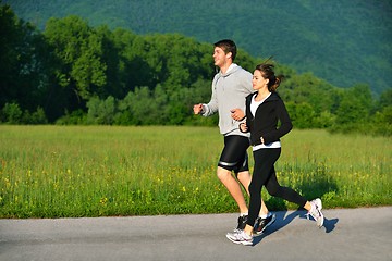 Image showing Young couple jogging