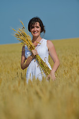 Image showing young woman in wheat field at summer