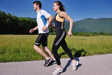 Image showing Young couple jogging