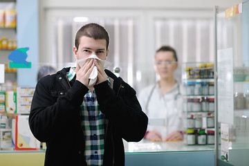 Image showing pharmacist suggesting medical drug to buyer in pharmacy drugstor