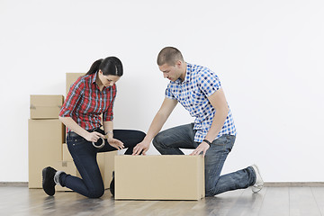 Image showing Young couple moving in new home