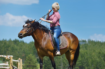 Image showing happy woman  on  horse