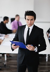 Image showing young business man at meeting