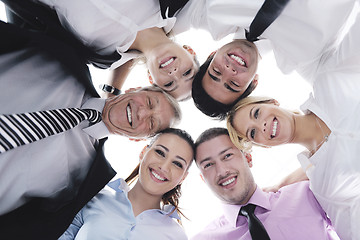 Image showing business people with their heads together