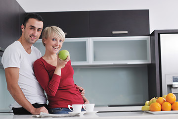 Image showing young couple have fun in modern kitchen