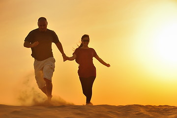 Image showing couple enjoying the sunset