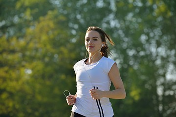 Image showing Young beautiful  woman jogging at morning in park