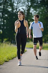 Image showing Young couple jogging at morning