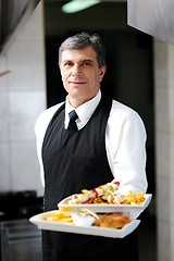 Image showing male chef presenting food