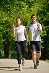 Image showing Young couple jogging