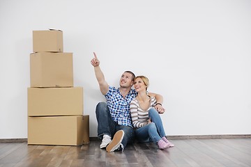 Image showing Young couple moving in new home