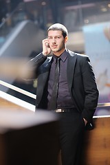 Image showing young business man talking by cell phone