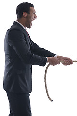 Image showing business man with rope isolated on white background