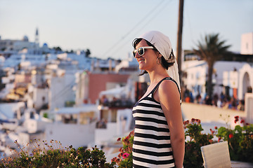 Image showing Greek woman on the streets of Oia, Santorini, Greece