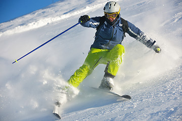 Image showing skiing on fresh snow at winter season at beautiful sunny day