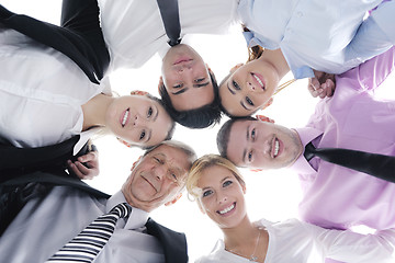 Image showing business people with their heads together