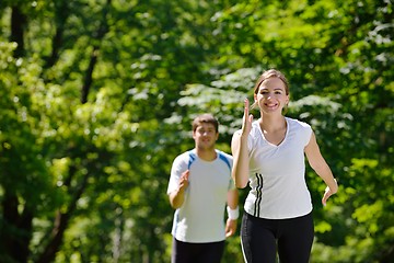 Image showing Young couple jogging