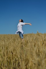 Image showing young woman in wheat field at summer