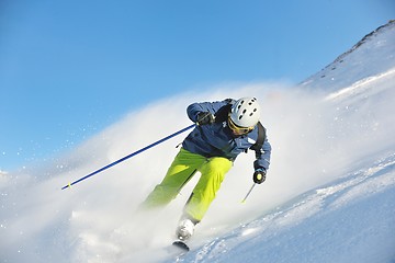 Image showing skiing on fresh snow at winter season at beautiful sunny day