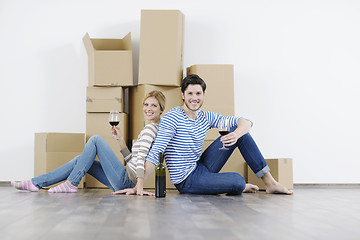 Image showing Young couple moving in new home