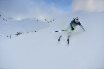 Image showing skiing on fresh snow at winter season at beautiful sunny day