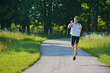 Image showing Young beautiful  woman jogging