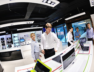 Image showing Young couple in consumer electronics store