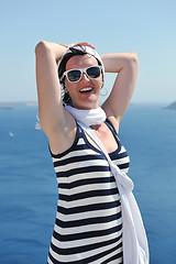 Image showing Greek woman on the streets of Oia, Santorini, Greece