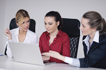 Image showing business woman group with headphones