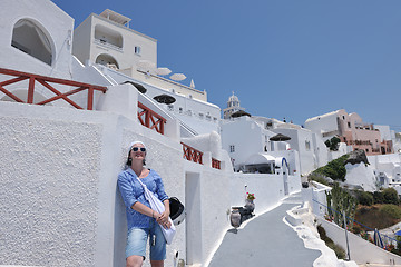 Image showing Greek woman on the streets of Oia, Santorini, Greece