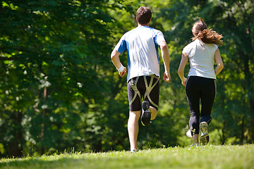 Image showing Young couple jogging