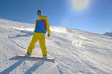 Image showing skiing on fresh snow at winter season at beautiful sunny day