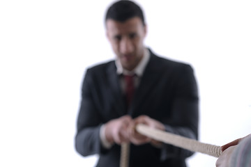 Image showing business man with rope isolated on white background