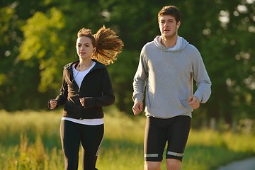 Image showing Young couple jogging