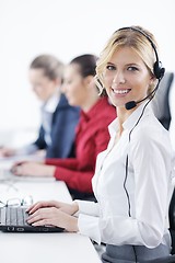 Image showing business woman group with headphones