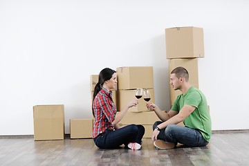 Image showing Young couple moving in new house