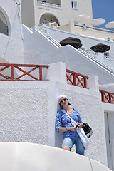 Image showing Greek woman on the streets of Oia, Santorini, Greece