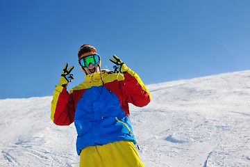 Image showing skiing on fresh snow at winter season at beautiful sunny day